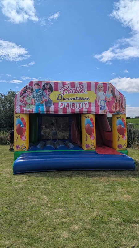 Barbie Dreamhouse Party bouncy castle with slide for parties in Cork