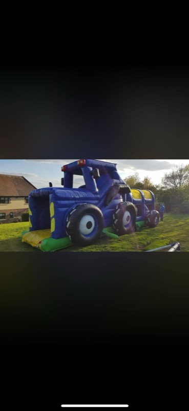 Blue tractor-shaped obstacle course with slide for parties in Cork