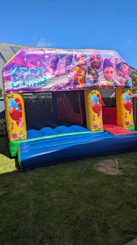 K-Pop Demon Hunters themed bouncy castle with slide for parties in Cork