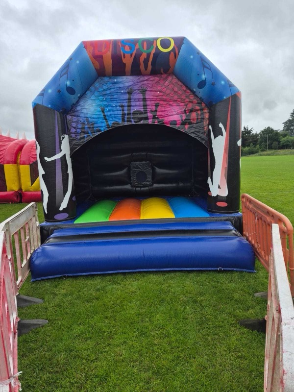 Blue disco-themed bouncy castle with dancer silhouettes for parties in Cork