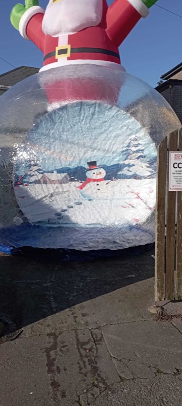 Giant inflatable snow globe with Santa figure for parties in Cork