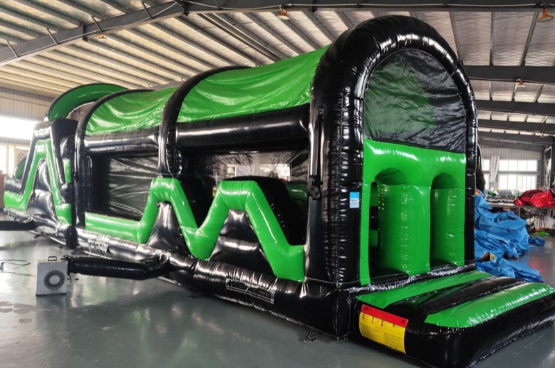 Black and green obstacle course tunnel for parties in Cork