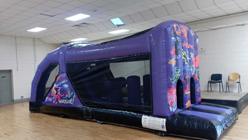 Purple graffiti-style Warrior obstacle course for parties in Cork